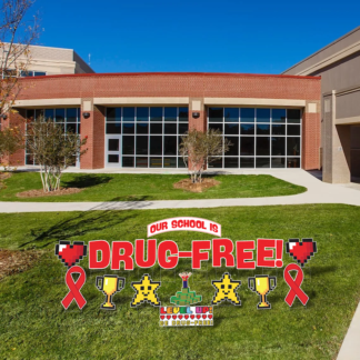 Level Up Be Drug-Free yard signs lawn display with pixel gaming themed pieces and red ribbon stakes for Red Ribbon Week